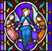Stained Glass Window depiction of the Assumption of Mary into Heaven.
