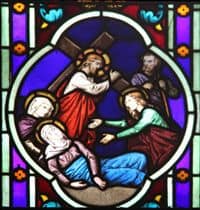 Stained Glass Window depiction of Jesus carrying His Cross.