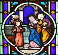 Stained Glass Window depiction of Jesus being found by Mary and Joseph in the Temple.