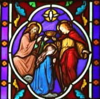 Stained Glass Window depiction of the Coronation of Mary in Heaven.