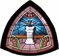 Stain-glass window image of Baptismal Font with dove above