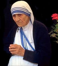 St Mother Teresa in her traditional white with blue edge clothing.