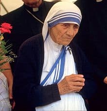 St Mother Teresa in her traditional white with blue edge clothing.