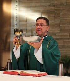 Priest at Eucharist of Holy Mass