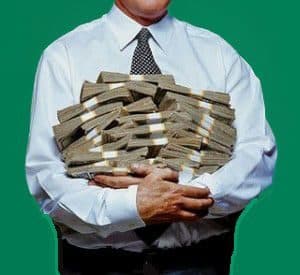Man with armful of money