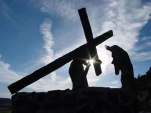 Silhouette of Jesus carrying the Cross