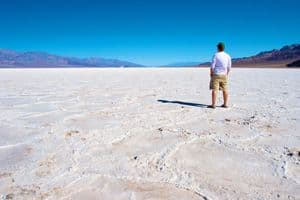 Man looking across a salt plain