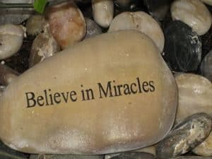 Stone with sign - Believe in Miracles