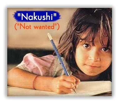 Smiling Indian girl writing with a pencil.