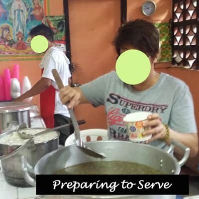 Volunteer workers preparing a meal.