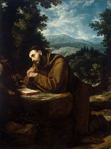 Image of St Francis of Assisi kneeling in prayer