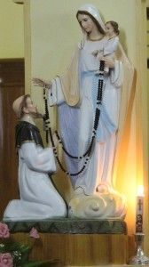St Dominic kneeling in front of the Blessed Virgin Mary