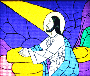 Stain-glass window depiction of Jesus Kneeling and a beam of light shining on him