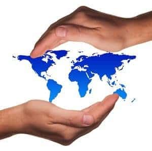 Map of world between two hands