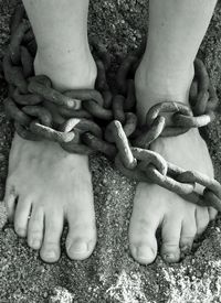 Chain wrapped around feet