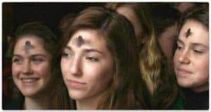 People with ashes on forehead