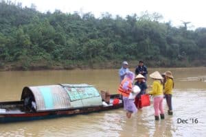 Volunteers carrying Food Parcels to river boat
